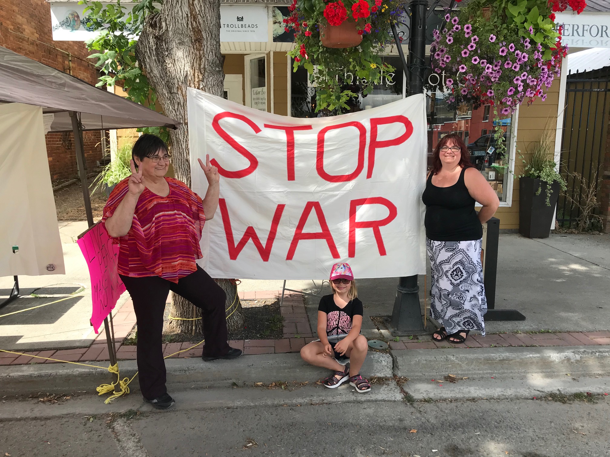 people in front of a "Stop War" sign